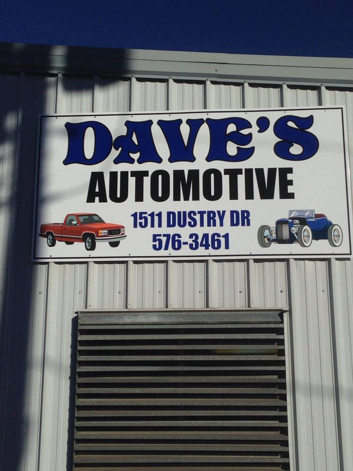 The Dave's Automotive sign mounted on the white steel shop building