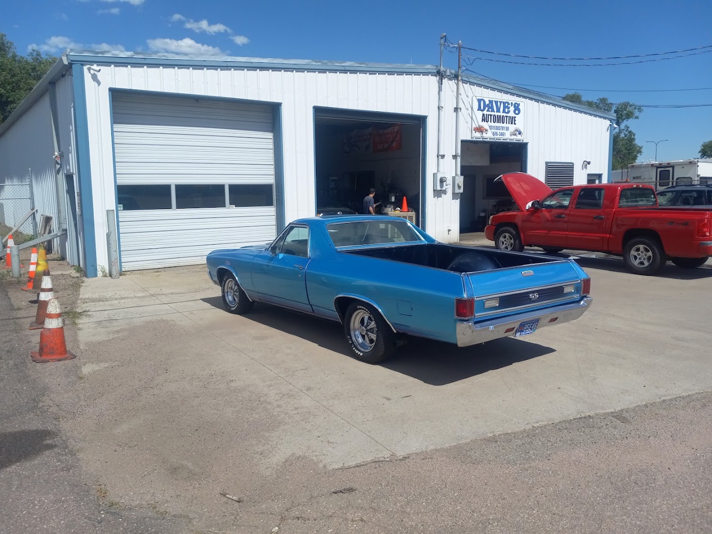 Inside the shop: a classic Mustang and Fort Carson police SUVs on the lifts